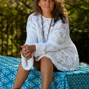 Woman wearing the white Lace Tunic #107, showing the wide lace sleeves