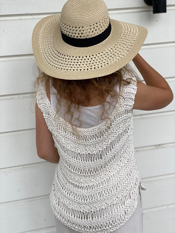 Back view of the Boho drop stitch top #112 in ecru, worn with a wide-brimmed straw hat