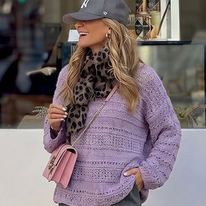 Woman wearing the Bell Sleeve Sweater #115 in lilac with a cap
