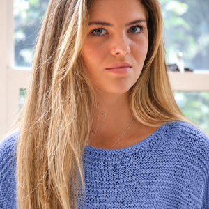 Close-up of the Tuva T-shirt #126 in sky blue, showing the textured front