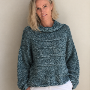 Runa Icicle Sweater #145 in turquoise, worn with cream trousers