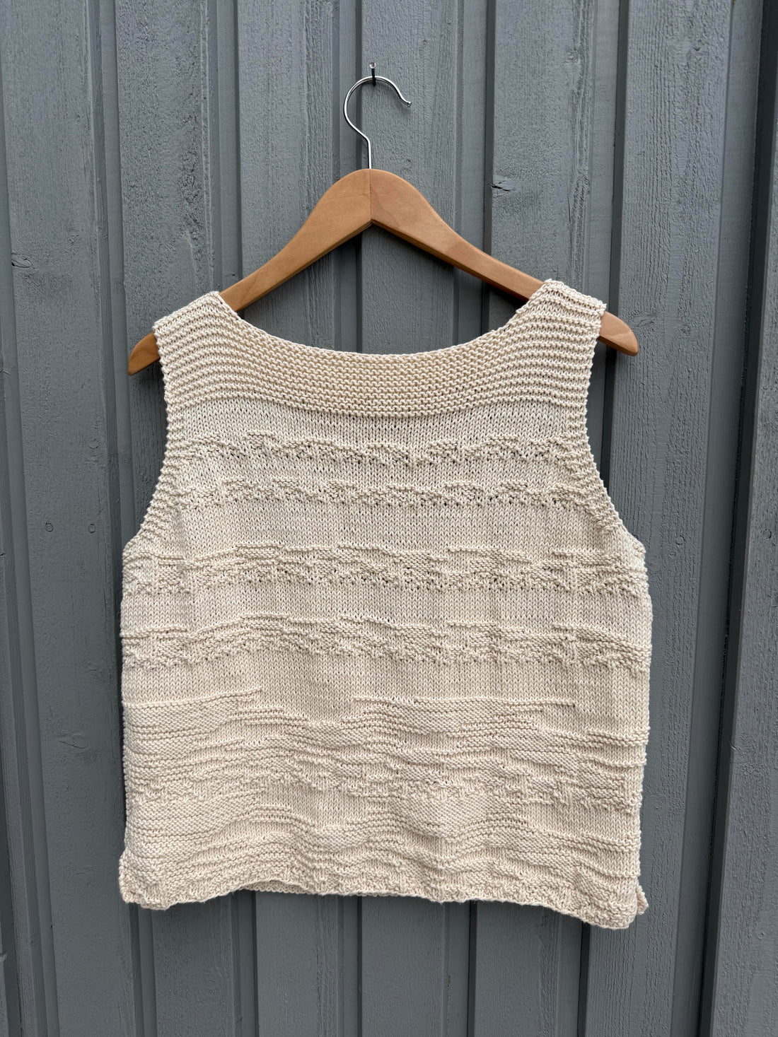 Frida Top #179 on a hanger, textured side out, in ecru cotton