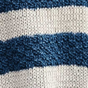 Close-up of the Svala sweater #182 showing ecru stocking stitch and denim double moss stitch stripes