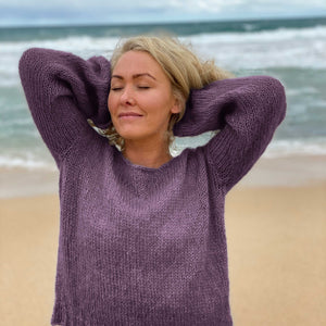 Woman wearing the Meja Feel Good Sweater #183 knitted in Scandi Soft XL Grape