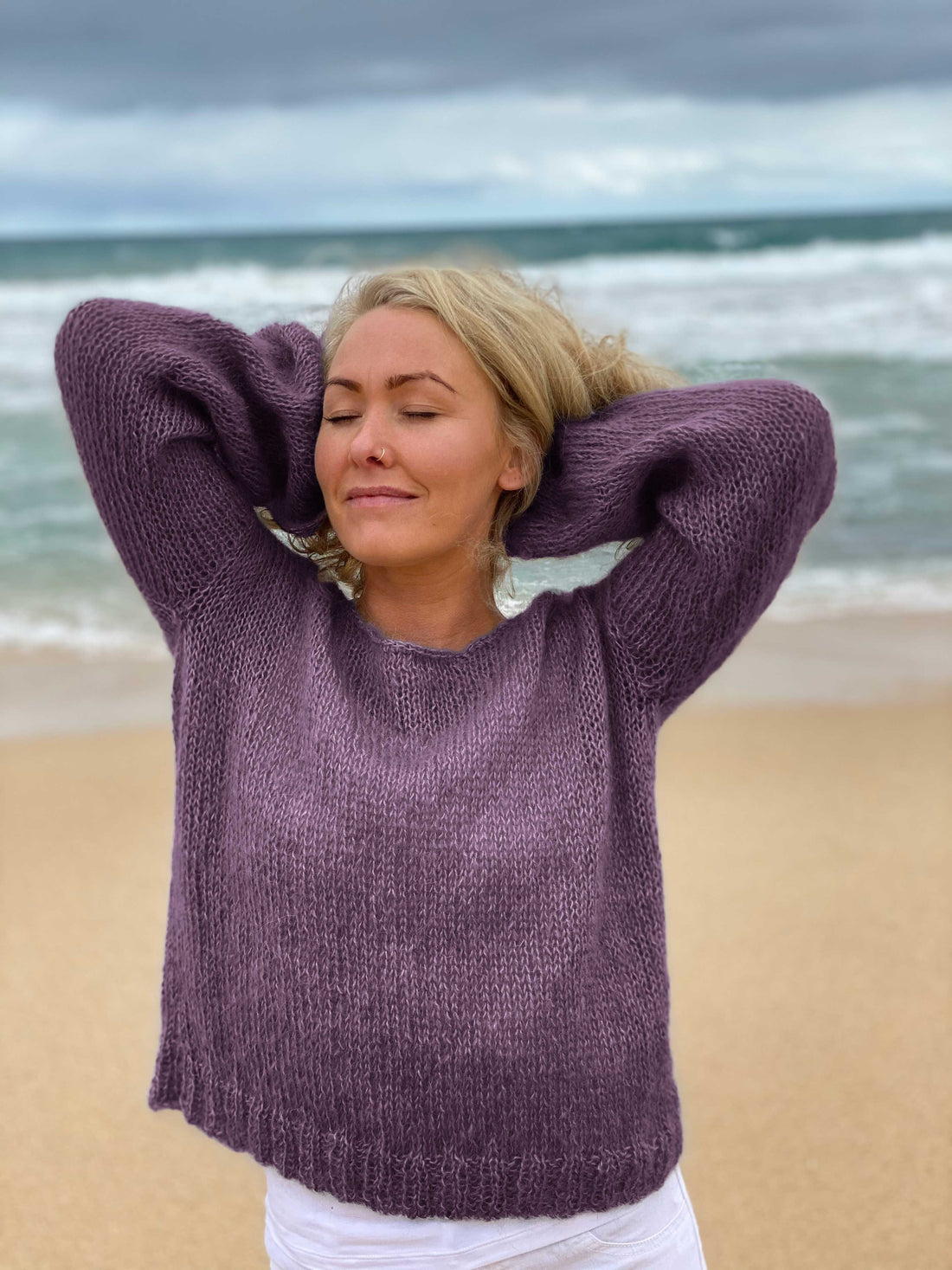 Woman wearing the Meja Feel Good Sweater #183 knitted in Scandi Soft XL Grape
