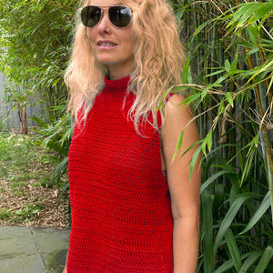 Woman in a garden wearing the Crochet Top #190 in red