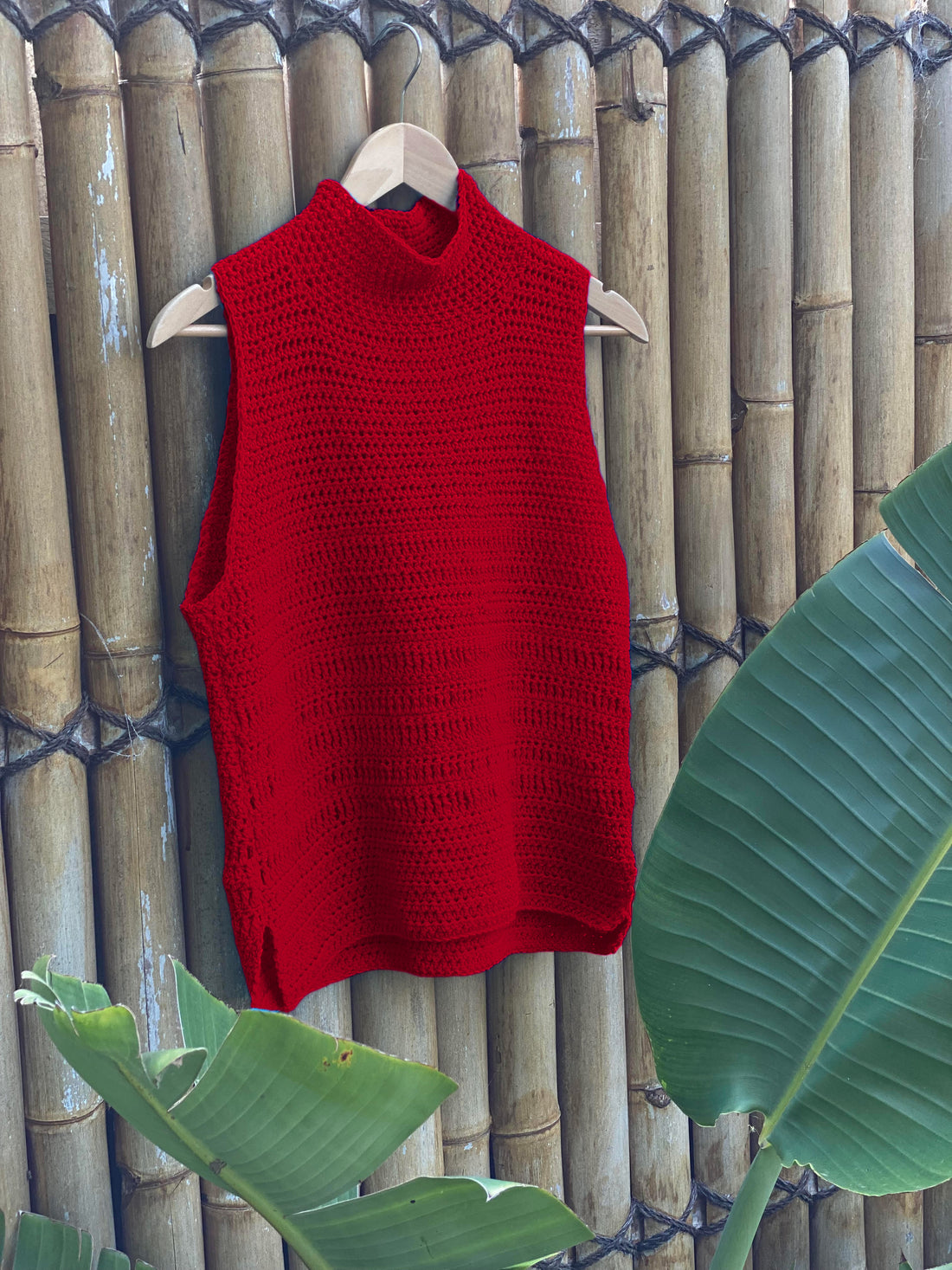 The Crochet Top #190 in red on a hanger, showing the high neck