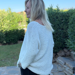 Side view of the Vilja sweater #301 in white, showing the grown-on sleeves and relaxed fit
