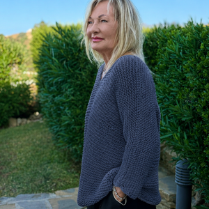 Side view of the Vilja sweater #301 in denim blue, showing the long, loose shape