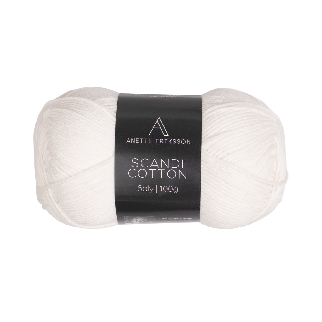 A ball of Anette Eriksson Scandi Cotton in white, the yarn used for the Vera Drop Stitch Dress #108