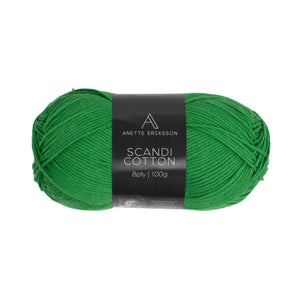 A ball of Anette Eriksson Scandi Cotton in emerald, the yarn the Textured Cardigan #142 is knitted in