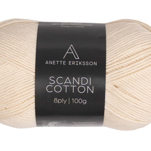 A ball of Anette Eriksson Scandi Cotton in ecru, the yarn the Elvi singlet #101 is knitted in