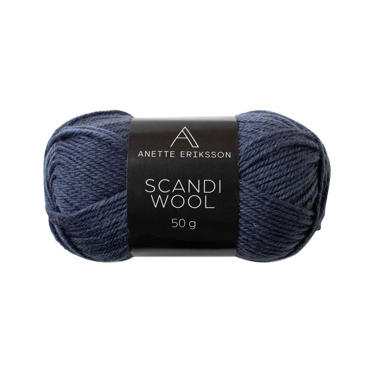 A ball of Anette Eriksson Scandi Wool yarn in Denim, a navy wool blend