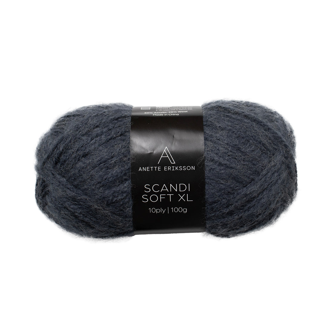 A ball of Anette Eriksson Scandi Soft XL yarn in Denim, a dark blue chunky wool blend