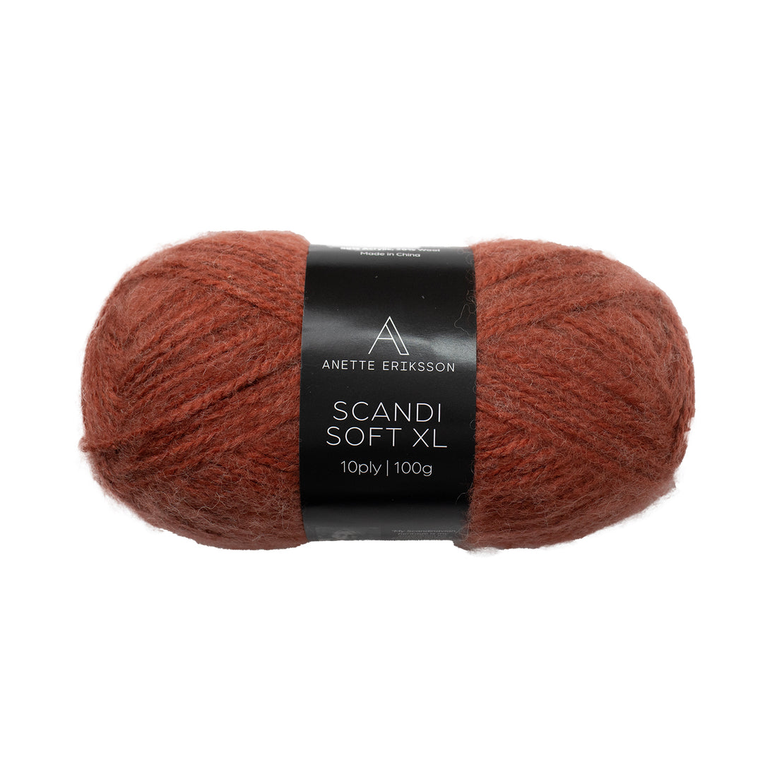 A ball of Anette Eriksson Scandi Soft XL yarn in Terracotta, a warm rust chunky wool blend