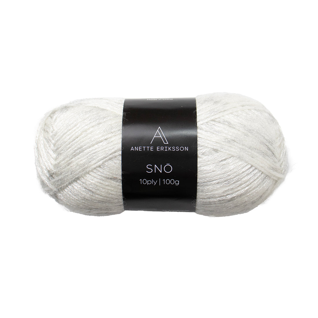 A ball of Anette Eriksson Snö yarn in Ice, an off-white shimmering wool blend