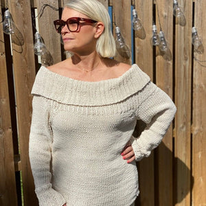 Woman wearing the chunky Bardot off-shoulder jumper #125 in cream, front view