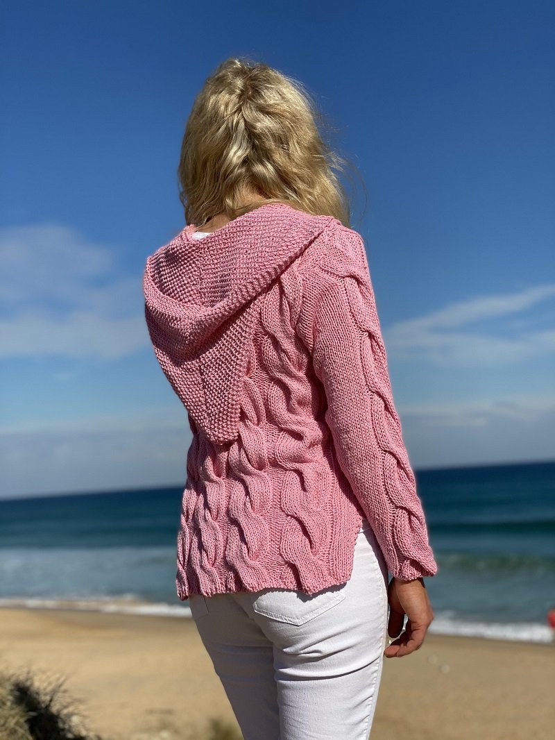 Back view of the Hooded Cable Jumper #172 in pink, showing the knitted hood