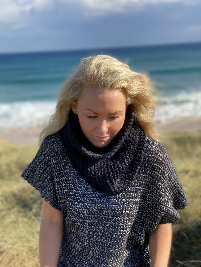 Woman in the dunes wearing the Crochet Tunic #148, showing the deep knitted collar